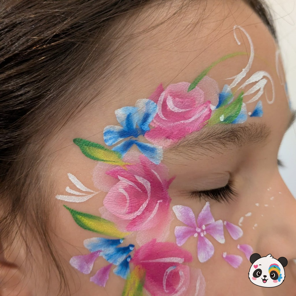 Pink roses and blue flowers painted around a child's eye