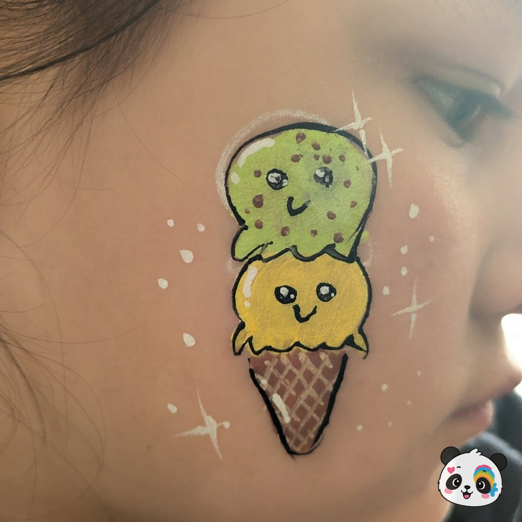 Kawaii ice cream cone face paint on a child's cheek